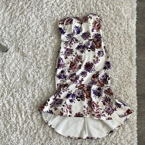 It’s a beautiful dress with stamped flowers, strapless, and elegant